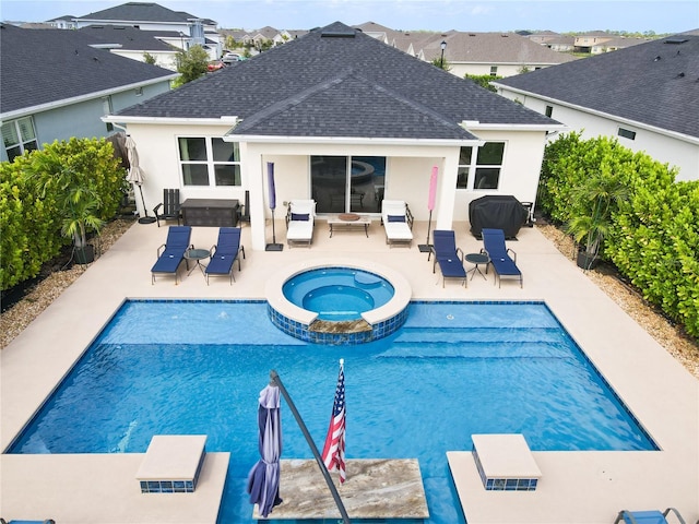 view of swimming pool with an in ground hot tub, a patio, grilling area, outdoor lounge area, and central air condition unit