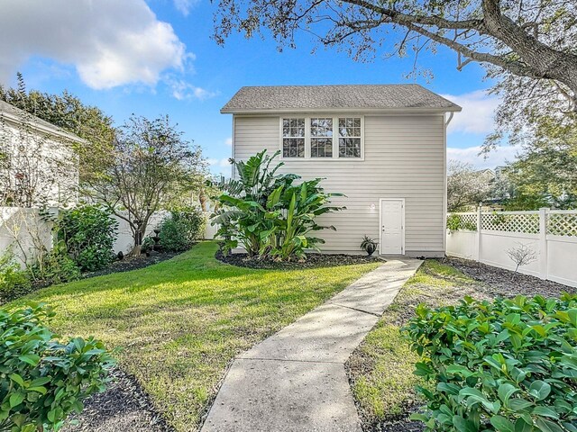 view of front of home with a front lawn