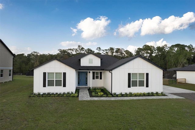 modern inspired farmhouse with a front yard