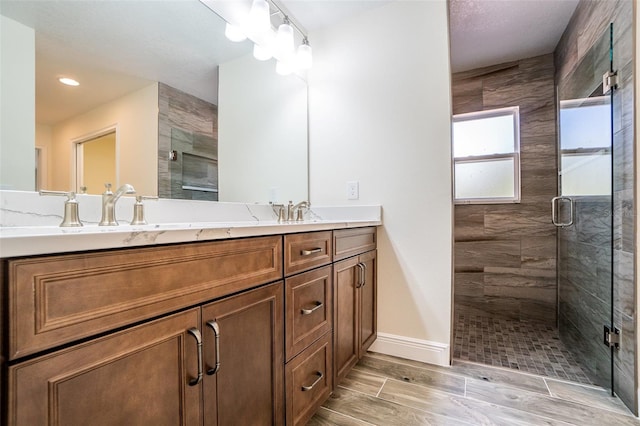 bathroom with vanity and walk in shower