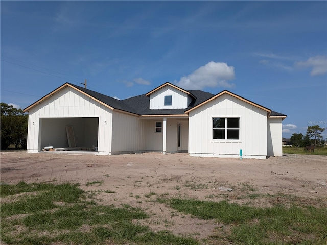3664 Cord Ave, Saint Cloud, FL 34772 - view of front of property featuring board and batten siding and a garage