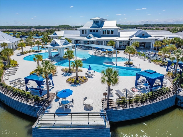 pool with a water view, a patio, and a gazebo