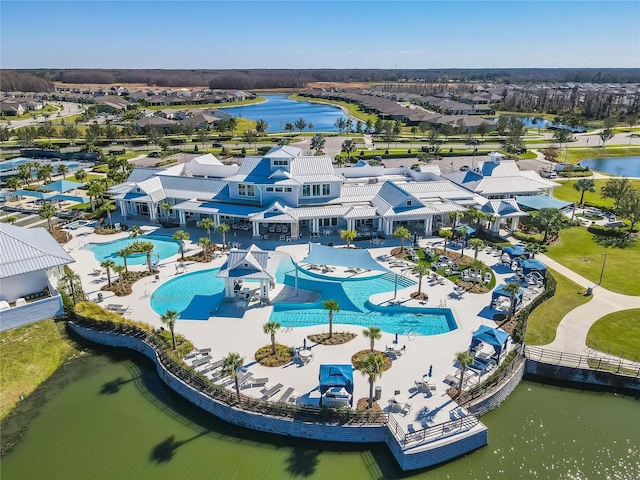 birds eye view of property featuring a water view and a residential view