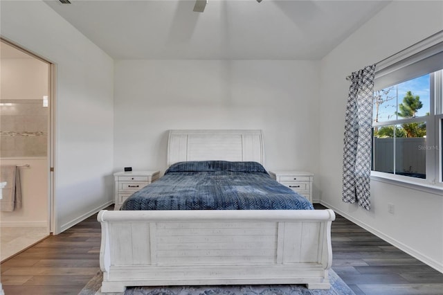 bedroom featuring ensuite bath, ceiling fan, and dark hardwood / wood-style flooring