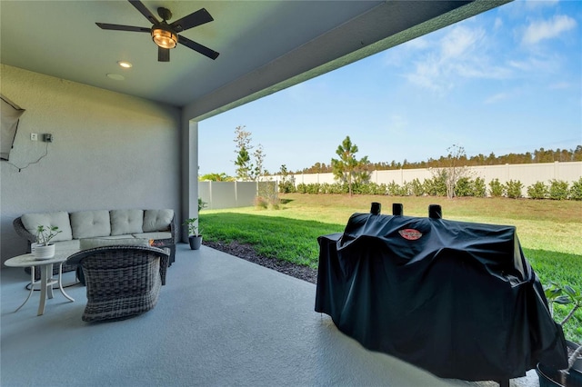 view of patio featuring area for grilling and ceiling fan