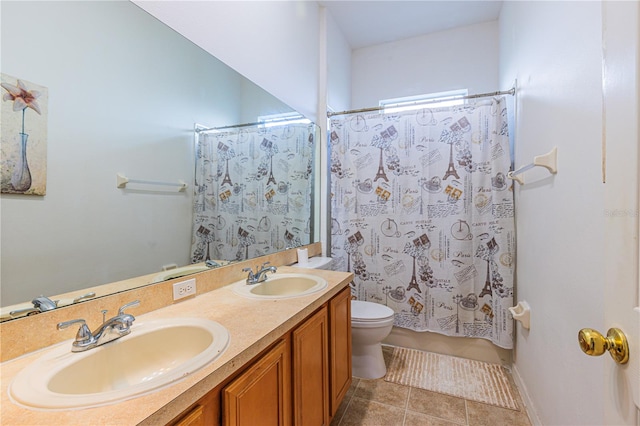 bathroom with vanity, toilet, and tile patterned flooring