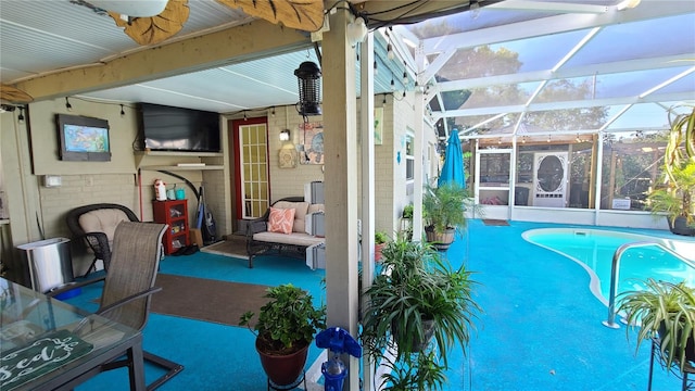 view of pool featuring a patio and glass enclosure