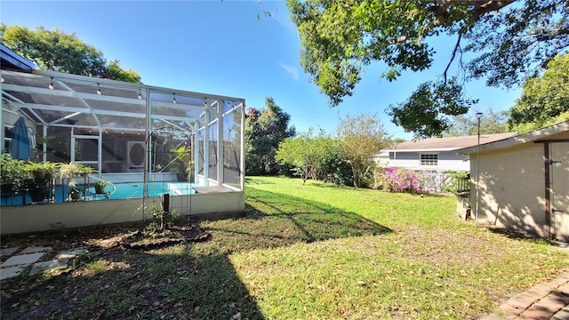 view of yard with a lanai