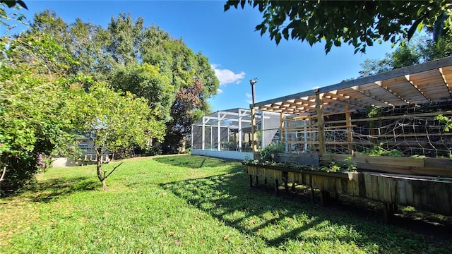 view of yard with glass enclosure