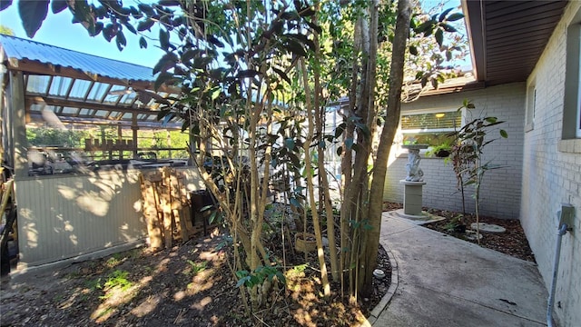 112 10th St, Saint Cloud, FL 34769 - view of home's exterior featuring brick siding and metal roof