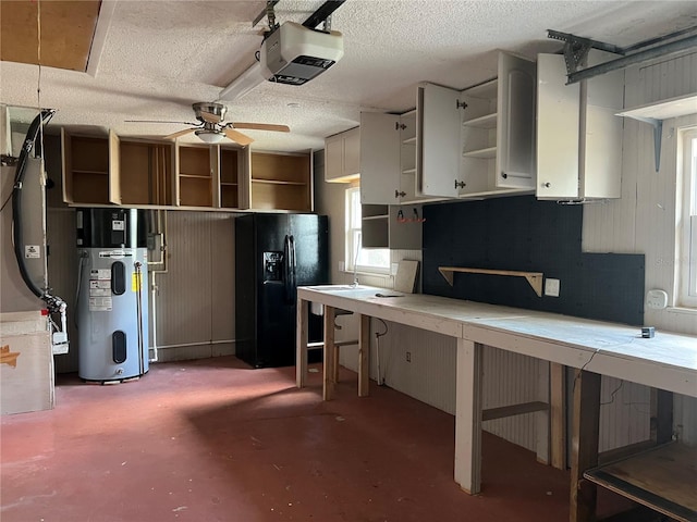 112 10th St, Saint Cloud, FL 34769 - kitchen featuring black fridge with ice dispenser, open shelves, concrete flooring, hybrid water heater, and ceiling fan