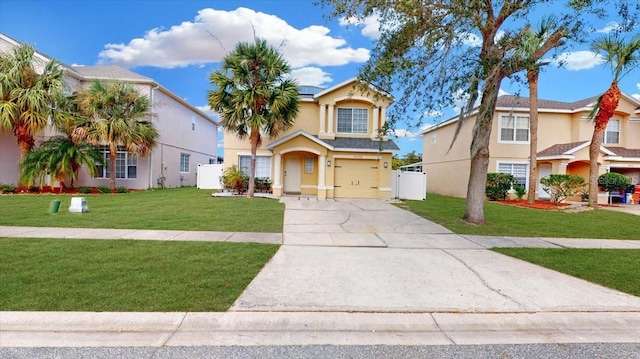 view of front of home with a front yard and a garage