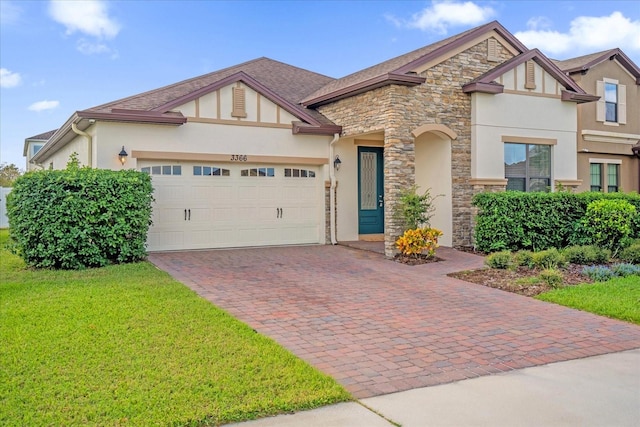 view of front of property with a front lawn and a garage