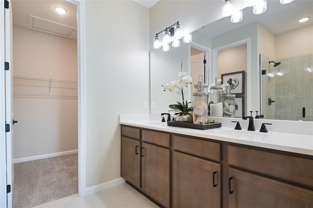 bathroom featuring vanity, walk in shower, and tile patterned floors