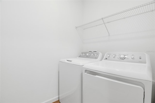 clothes washing area featuring laundry area and independent washer and dryer