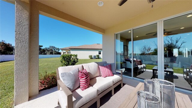 view of patio with outdoor lounge area, a ceiling fan, and fence