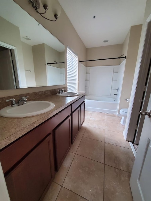 full bathroom featuring vanity, toilet, shower / bath combination, and tile patterned floors