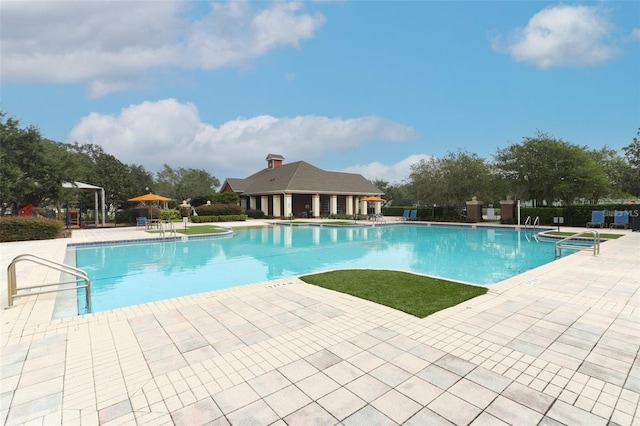 view of swimming pool featuring a patio