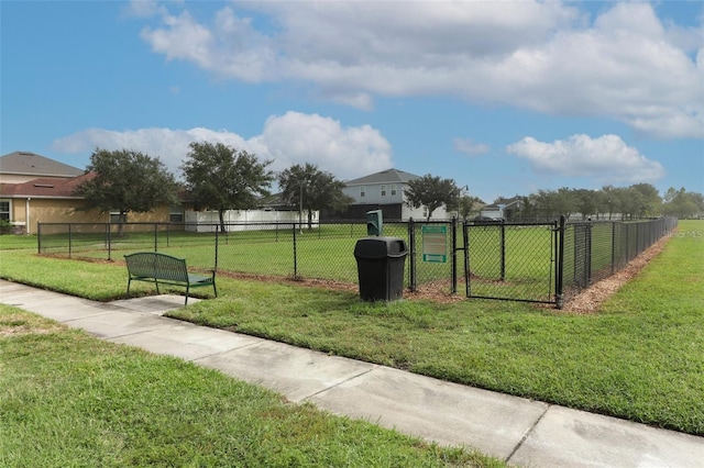 view of property's community with a yard