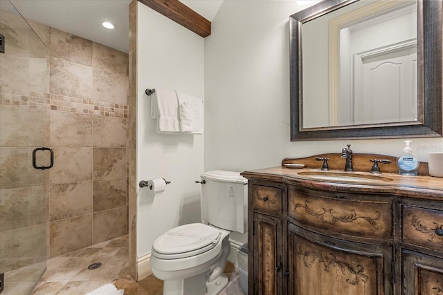 bathroom with vanity, toilet, and an enclosed shower