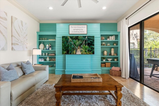 living area with crown molding, tile patterned flooring, and ceiling fan