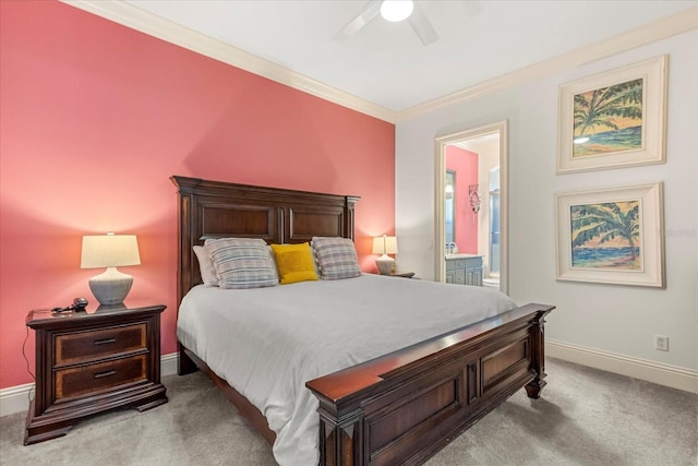 carpeted bedroom with connected bathroom, ornamental molding, and ceiling fan