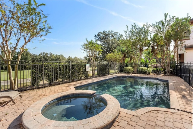 view of pool featuring an in ground hot tub