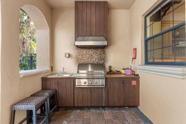 view of patio / terrace featuring area for grilling, grilling area, and sink