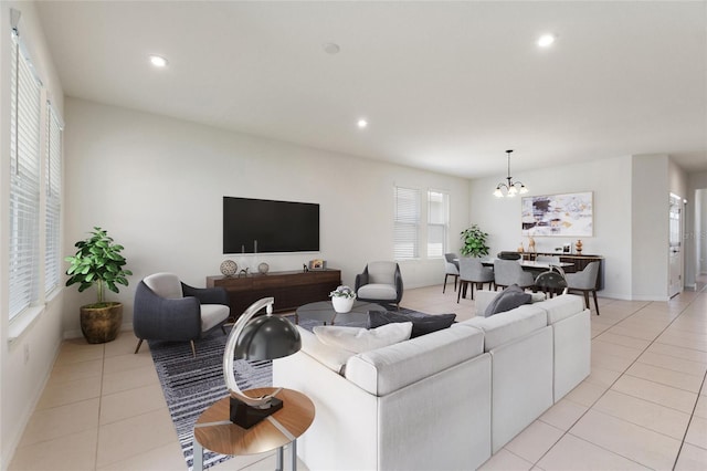 living room with a notable chandelier and light tile patterned floors