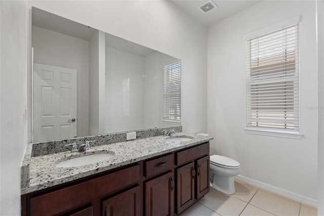 bathroom featuring vanity, toilet, and tile patterned flooring