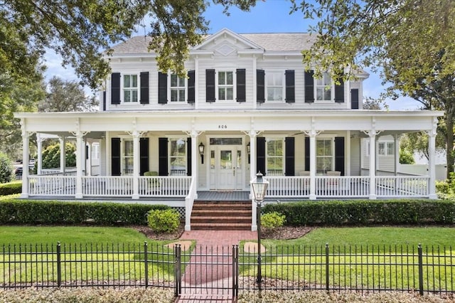 view of front of house featuring a front lawn and a porch