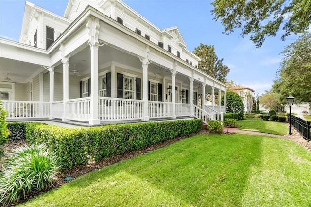 view of home's exterior featuring covered porch and a yard