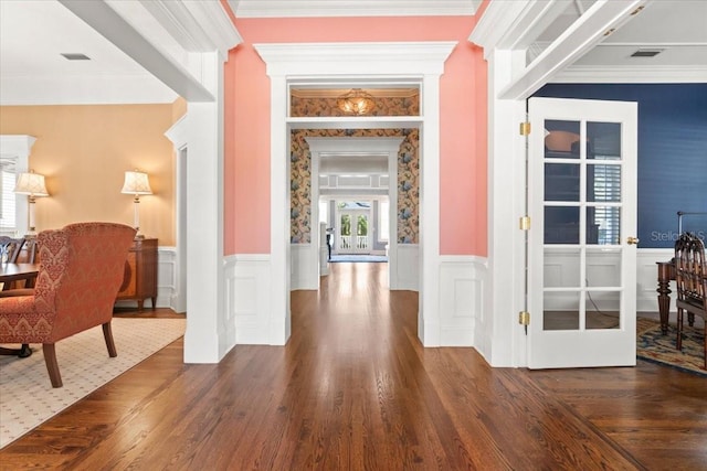 hall featuring crown molding and dark hardwood / wood-style flooring