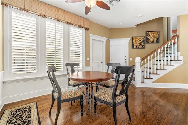 dining room with ceiling fan, plenty of natural light, and hardwood / wood-style floors