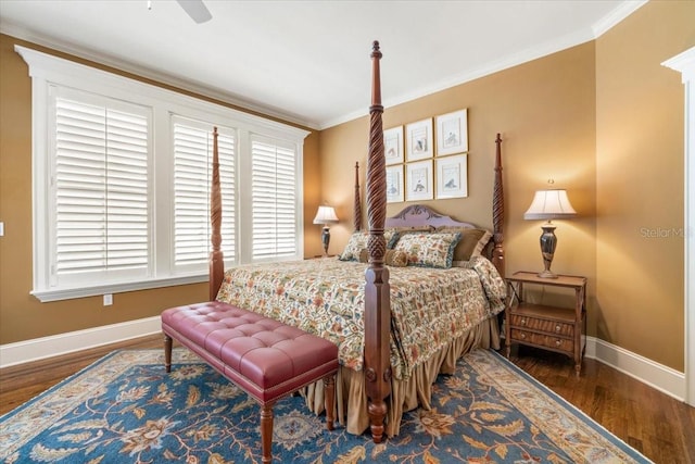 bedroom with crown molding, dark wood-type flooring, and ceiling fan