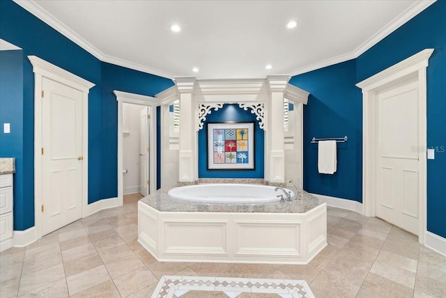 bathroom featuring vanity, ornamental molding, tile patterned flooring, and a bathing tub