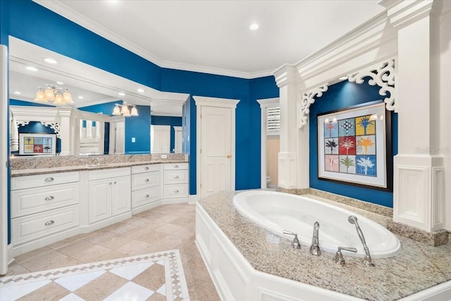 bathroom featuring vanity, crown molding, and a tub to relax in