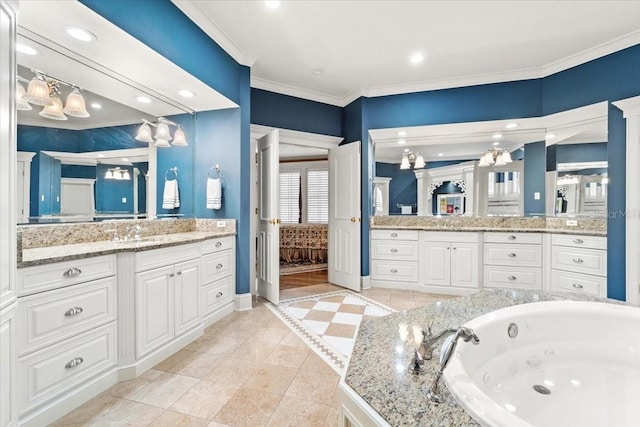 bathroom with vanity, ornamental molding, and a tub