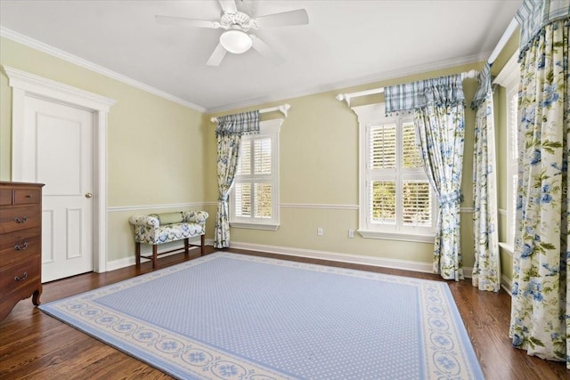 unfurnished bedroom with dark wood-type flooring, ceiling fan, and crown molding