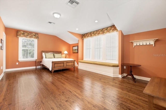 unfurnished bedroom featuring dark hardwood / wood-style floors and vaulted ceiling