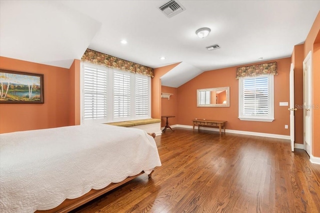 bedroom with lofted ceiling and hardwood / wood-style flooring