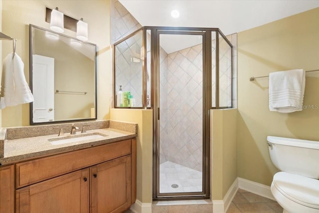 bathroom featuring vanity, toilet, walk in shower, and tile patterned flooring