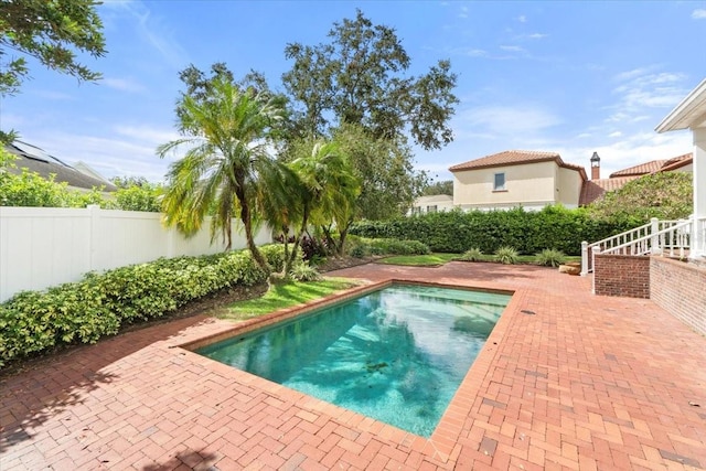 view of pool featuring a patio