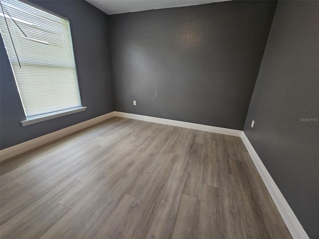 spare room featuring hardwood / wood-style floors