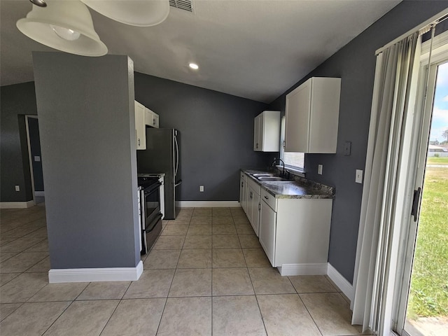 kitchen featuring light tile patterned floors, black electric range oven, vaulted ceiling, and white cabinets