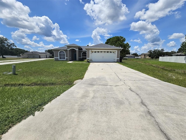 single story home featuring a front lawn and a garage