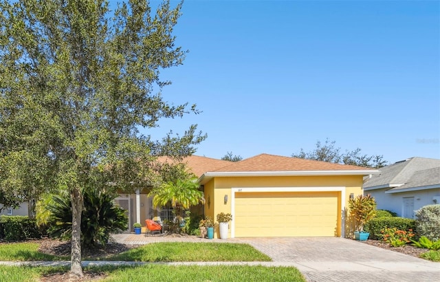 single story home with a garage