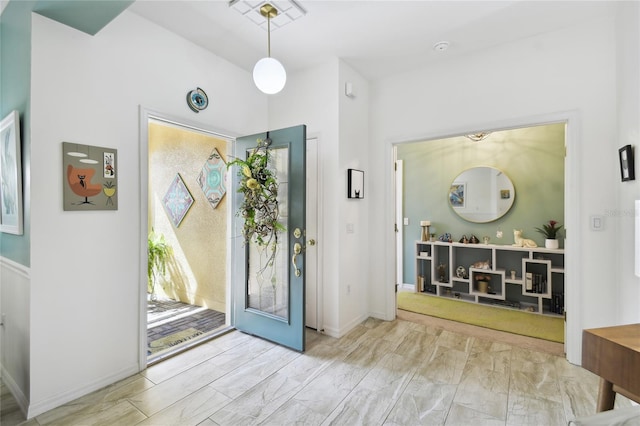 entryway with light hardwood / wood-style flooring