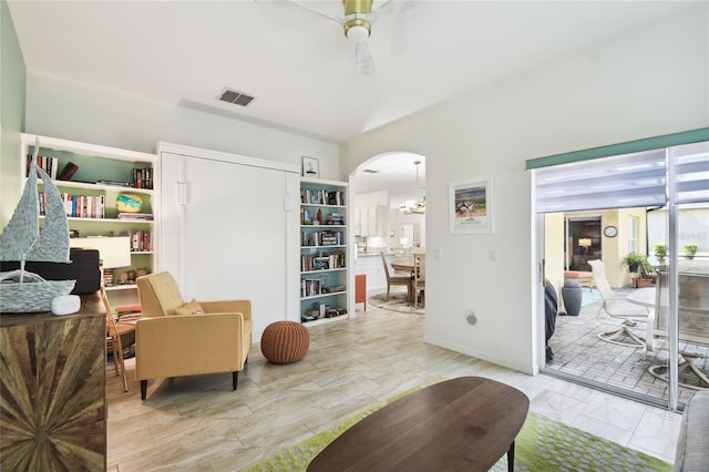 interior space with ceiling fan