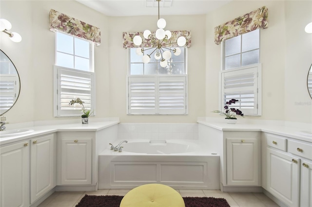 bathroom with tile patterned flooring, vanity, a chandelier, and a bathtub